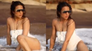 Nia Sharma gets cheeky in white swimsuit on beach, watch