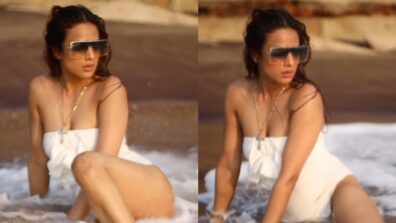 Nia Sharma gets cheeky in white swimsuit on beach, watch