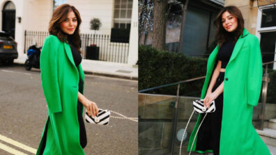 Kanika Kapoor Looks Ravishing In A Black Crop Top And Pants With Long Green Coat
