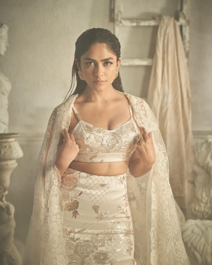 Mrunal Thakur Looks Like A Royal Princess In A Cream Colored Floral Printed Lehenga Set 783577