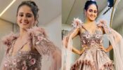 Why is Ayesha Singh blushing and smiling?