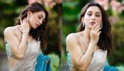 A dash of turquoise and glitter is what Mimi Chakraborty calls for a traditional drape