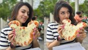 Foodie Frenzy! Hansika Motwani relishes a “Mickeylicious” pizza at Disneyland Paris