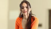 Urfi Javed takes internet by storm in preppy orange front-open crop top and denim jeans
