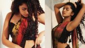 Anupama Parameswaran’s floral multi-coloured georgette saree comes with a black sequinned blouse