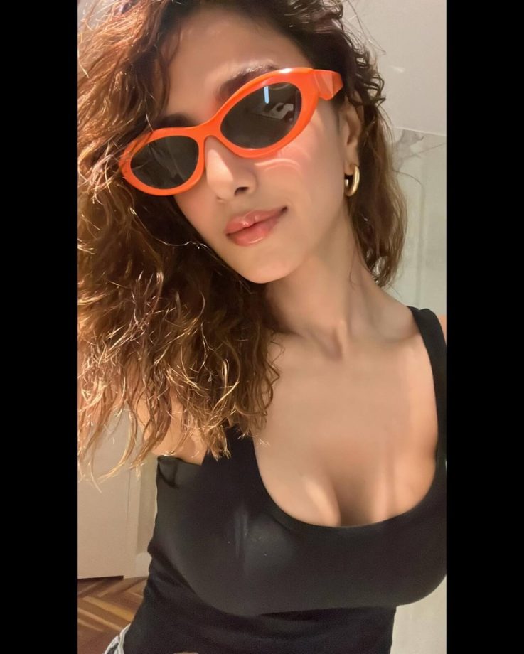 In Photos: Vaani Kapoor Spreads Casual Charm In Black Low Neckline Top And Ripped Denim 850187