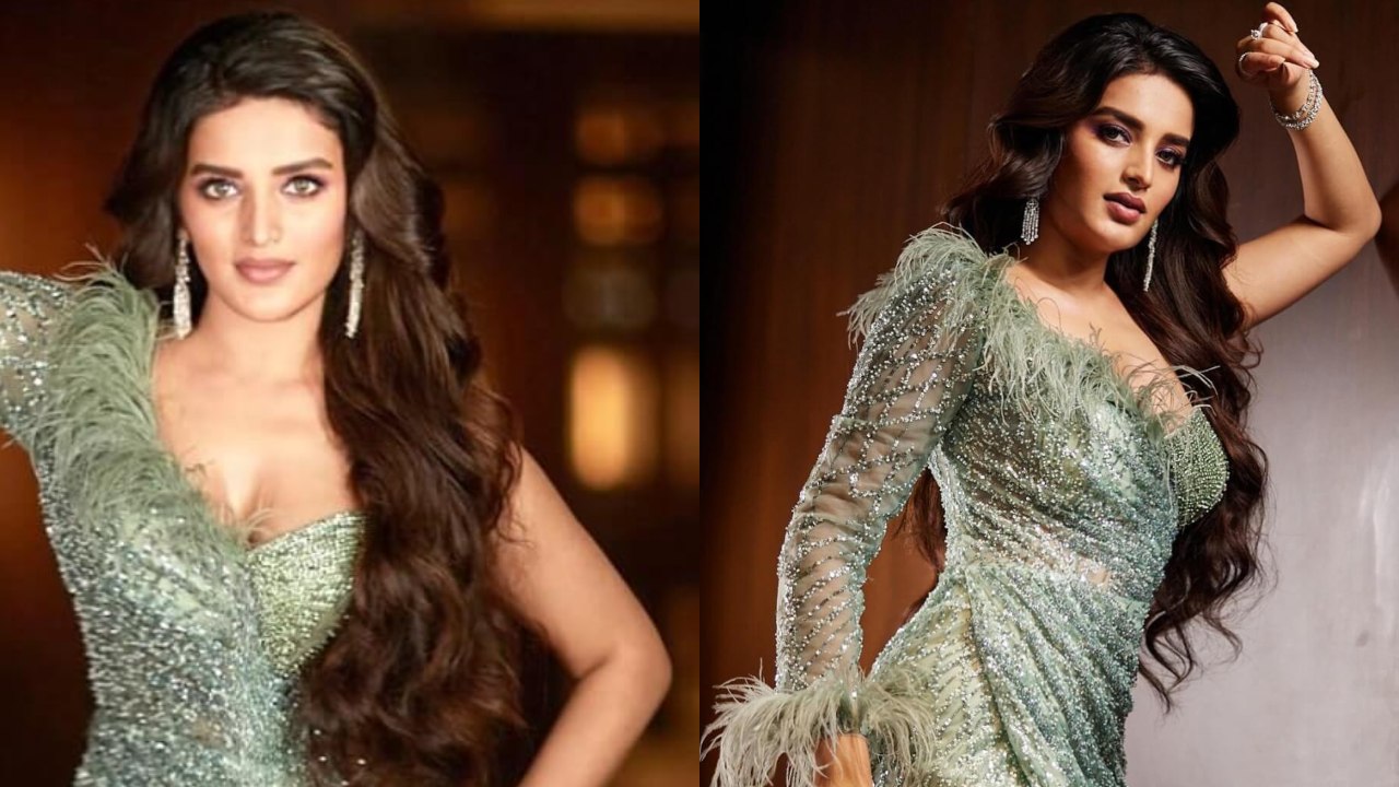 Niddhi Agerwal Makes Stellar Appearance In Pastel Green Glitter Embellished Thigh-high Slit Gown With Frills And Accessories 852381