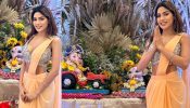 Nikki Tamboli Welcomes Bappa In Beige Chiffon Saree And Deep Neck Blouse Design With Diamond Bracelet