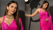 Rakul Preet Singh Poses In Pink Satin Saree, Halter Neck Blouse And Statement Necklace