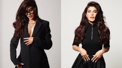 Corporate Couture: Jacqueliene Fernandez startles in black pantsuit and nerdy glasses