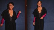 Kareena Kapoor gives her black plunging neck dress a rani pink twist, and we are in love