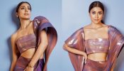 Shriya Saran twirls in contemporary flair in metallic structured saree